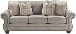 Signature Design By Ashley Olsberg Faux Leather Loveseat With Nailhead Trim And 2 Accent Pillows, Gray & Olsberg Faux Leather Ottoman With Nailhead Trim, Gray -Safavieh Furnitue Shop 41t34WxEG4L. AC